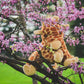 Close-up of plush giraffe featuring realistic spots and embroidered details.
